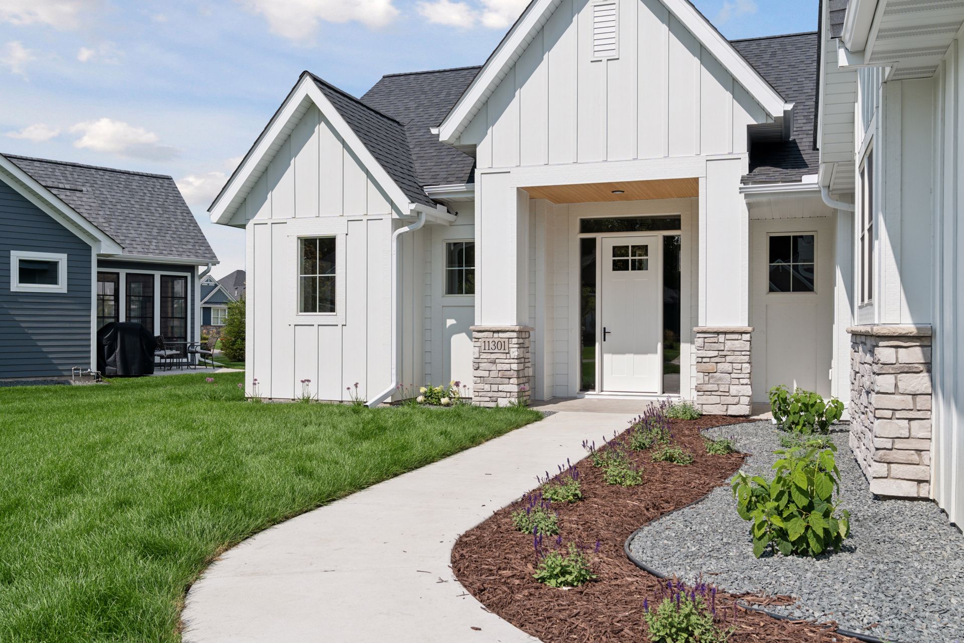 Nicely landscaped walkway leading to front door