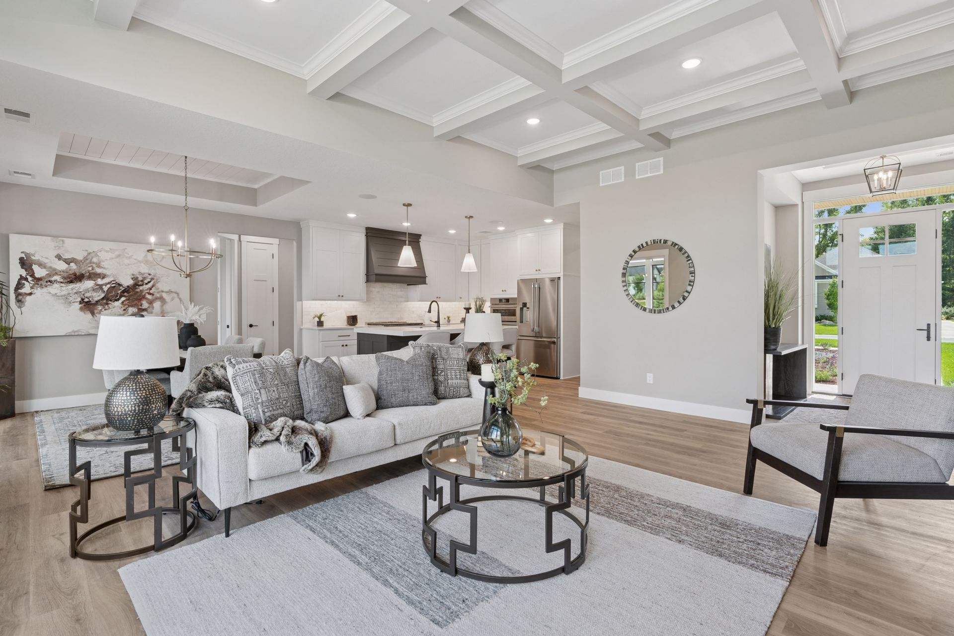 Spacious open concept design connecting great room, kitchen, and dining areas