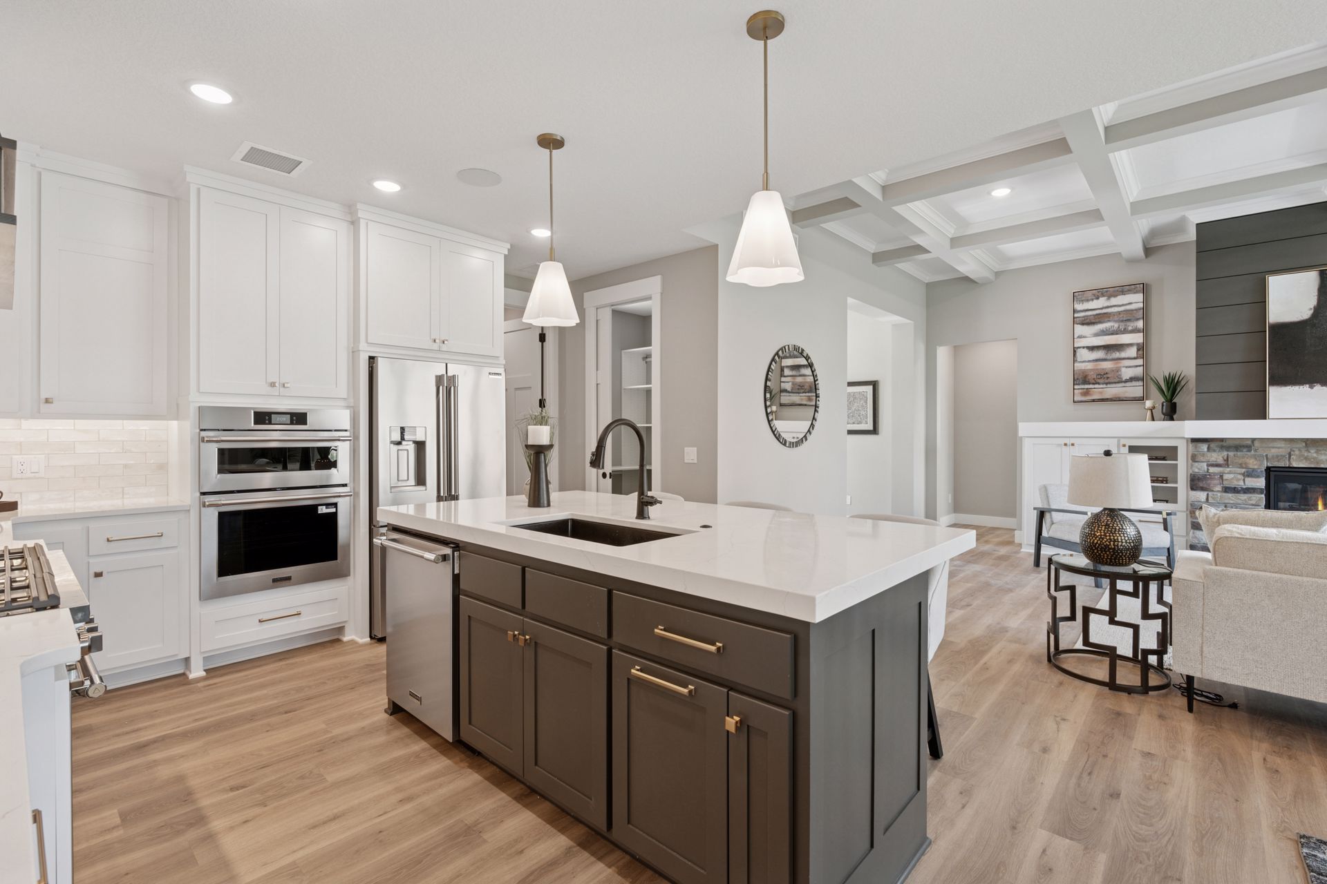 Large kitchen island with sink, dishwasher, and ample storage