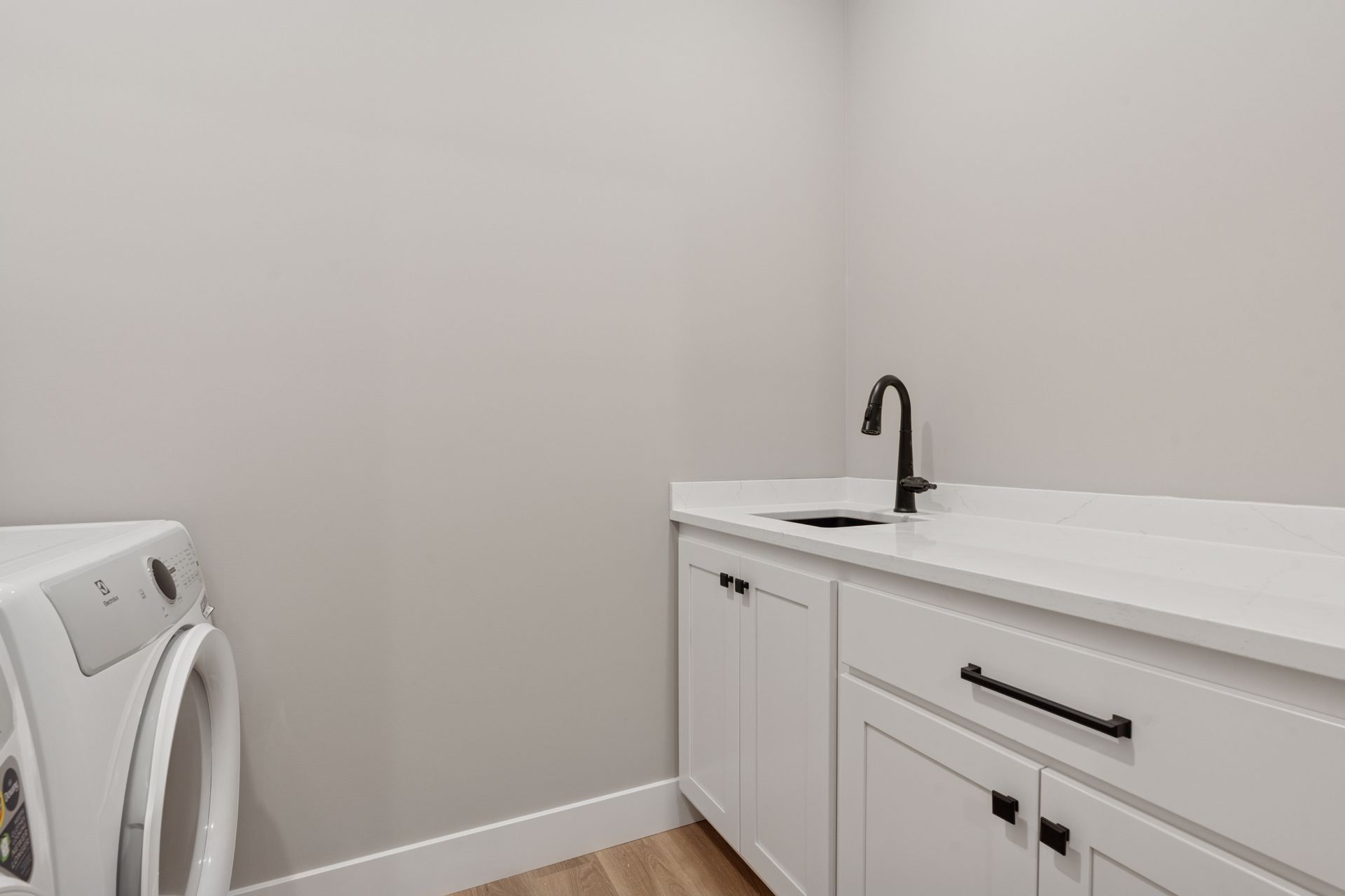 Laundry room utility sink and cabinets