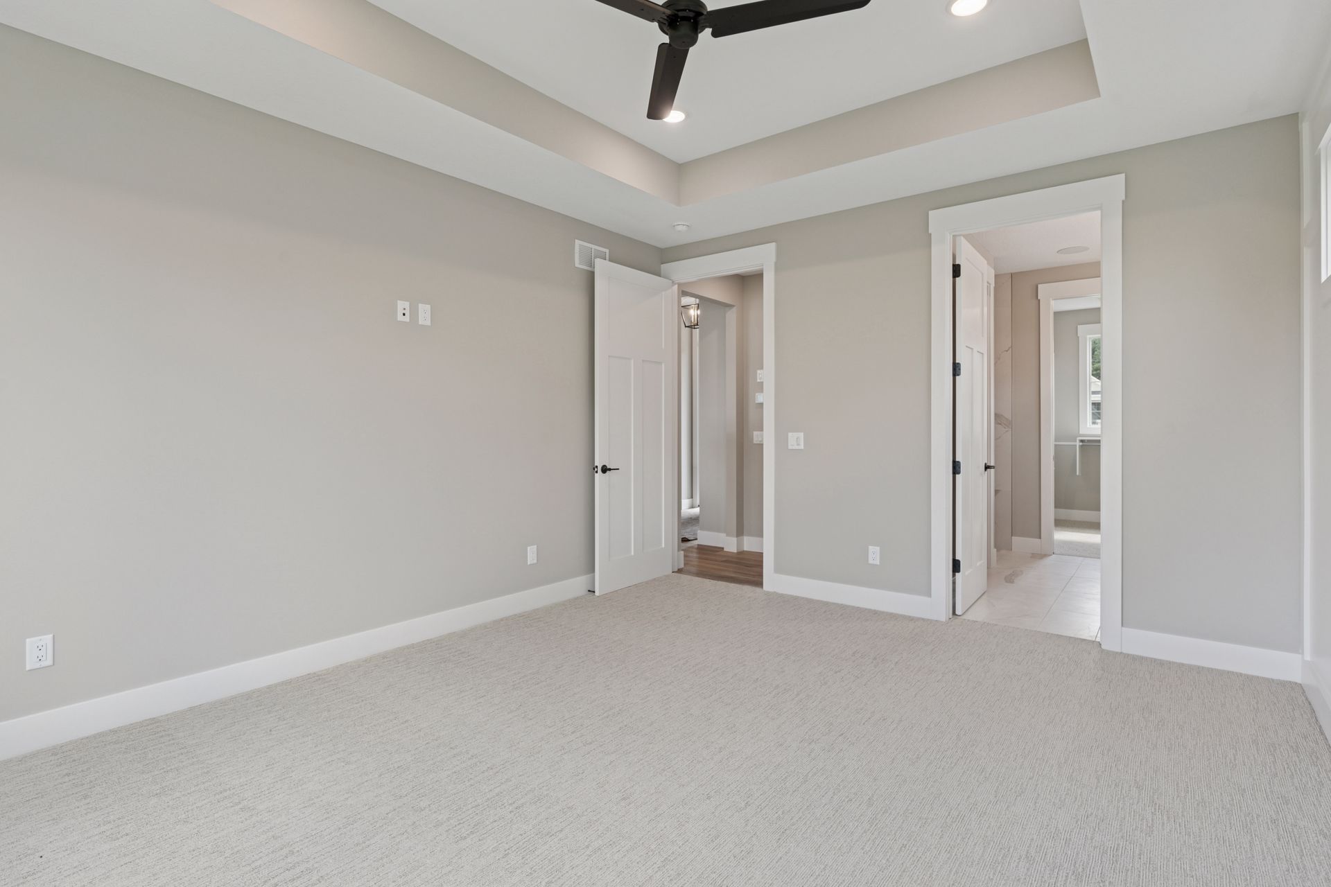 Spacious owner’s suite with vaulted ceiling and ceiling fan