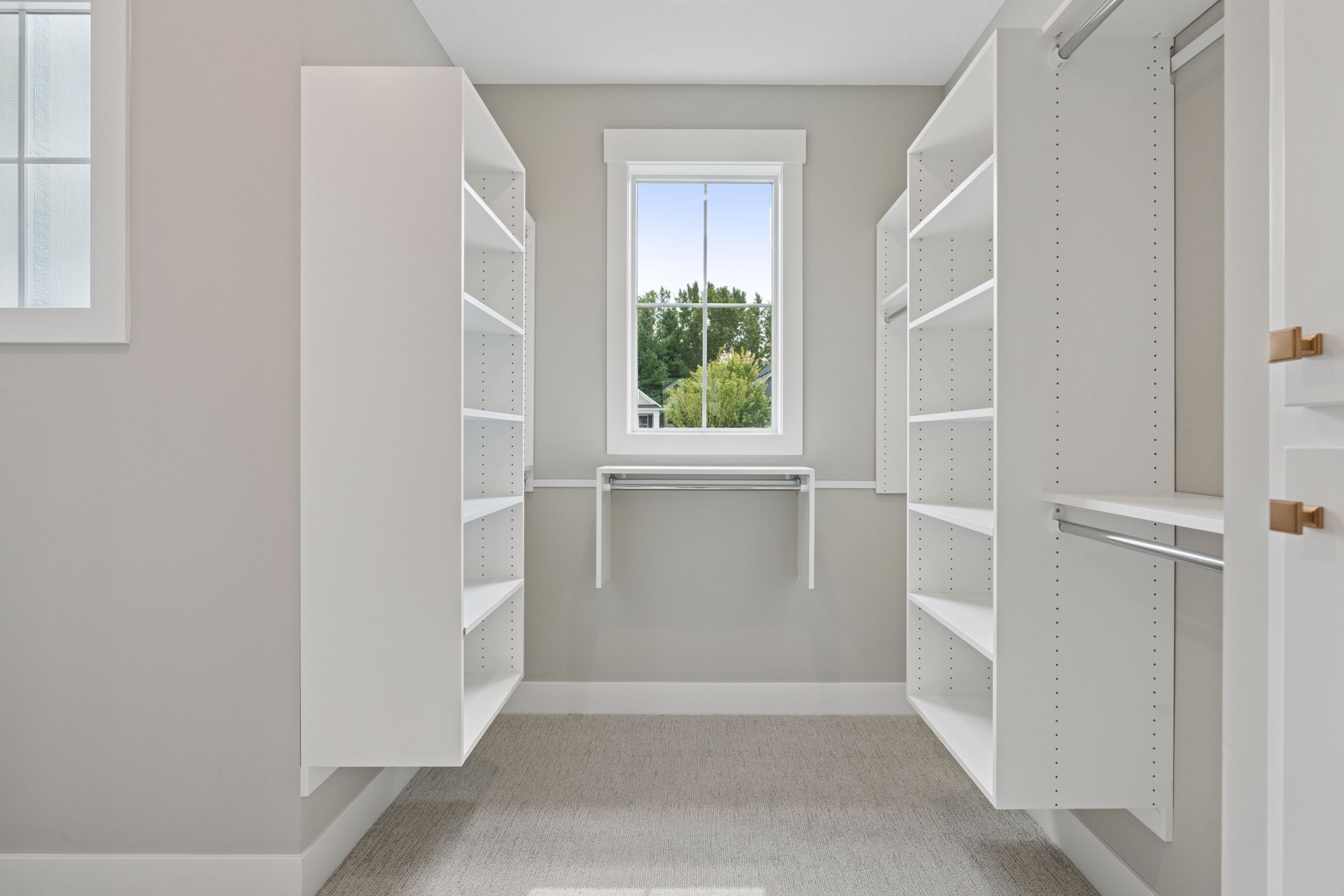 Extra-large walk-in closet with custom built-in organizers