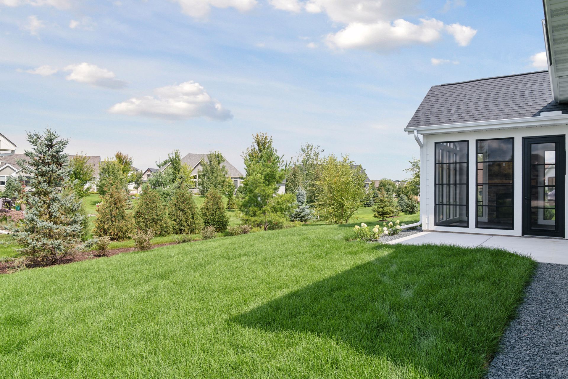 Large landscaped backyard with park-like feel