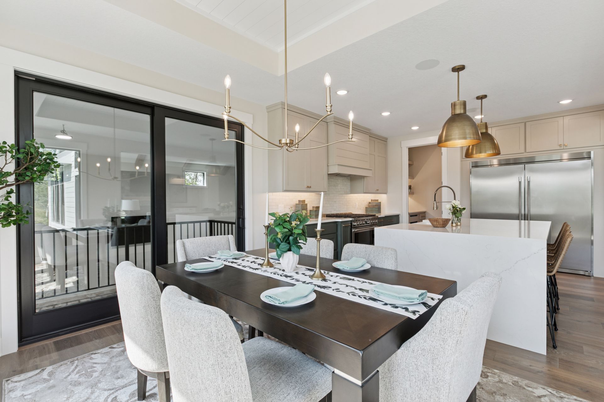 Dining area open to kitchen in seamless floor plan