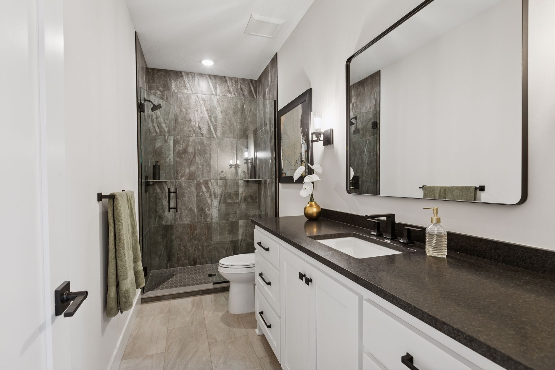 Glass-enclosed tile shower with modern design